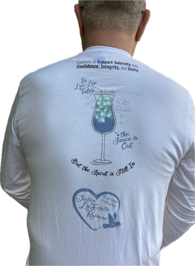 White shirt featuring a drink graphic and handwritten text on the back.
